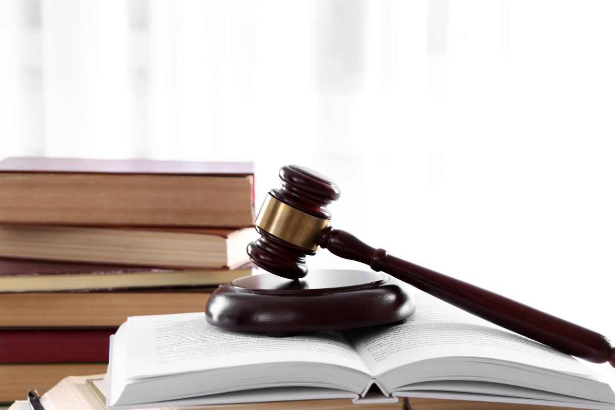 A judge’s gavel resting on an open law book. A judge’s gavel resting on an open law book.