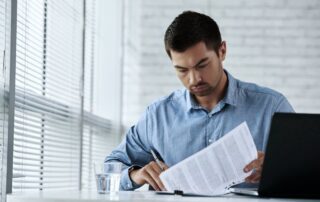 Man sitting alone representing himself without a lawyer.