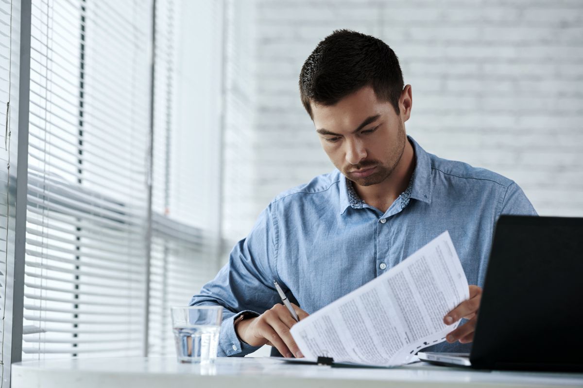 Man sitting alone representing himself without a lawyer.