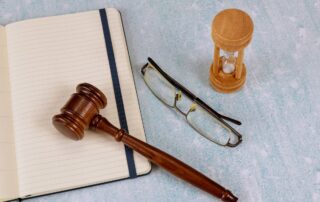 Gavel and clock representing legal timeline and court process.