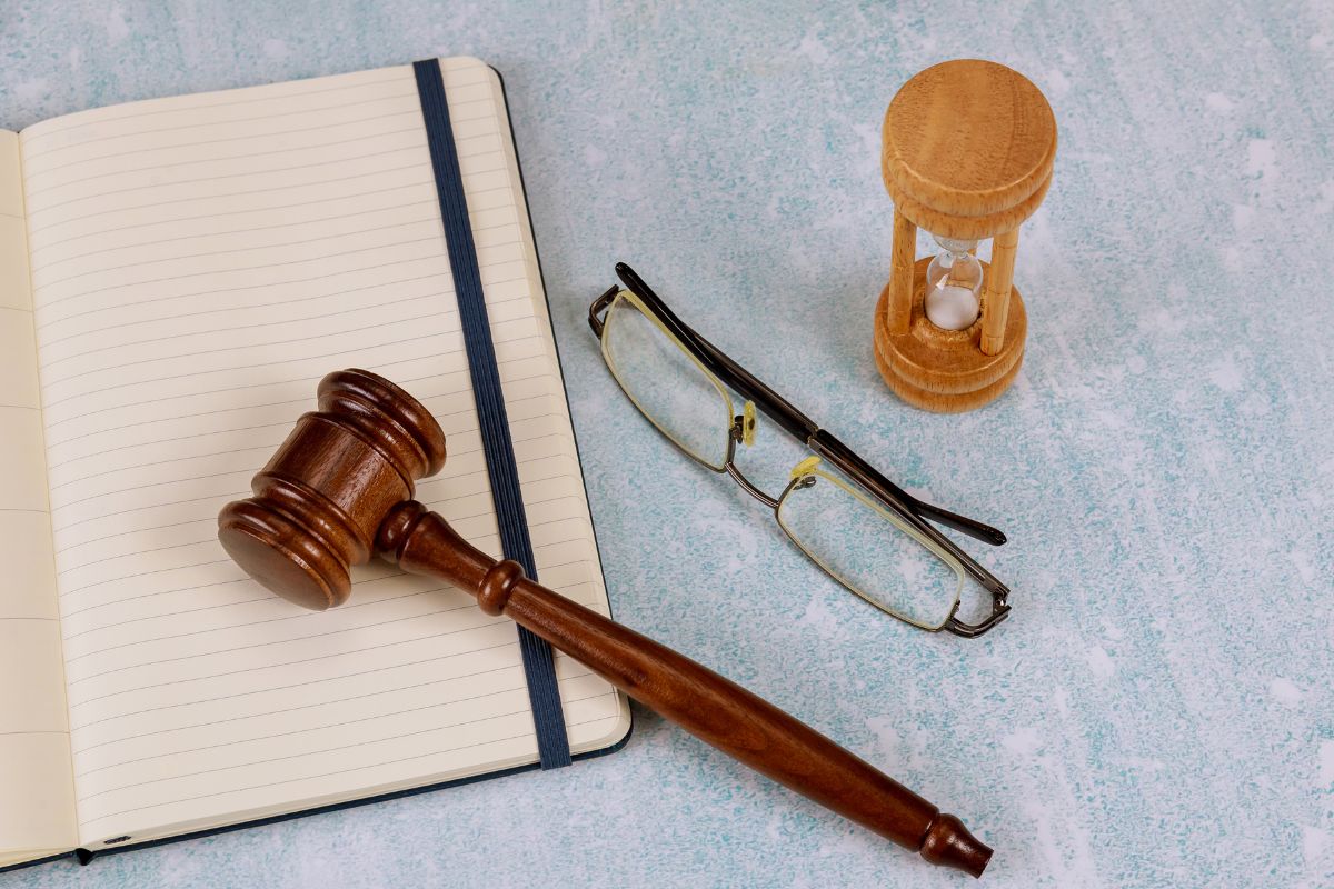 Gavel and clock representing legal timeline and court process.