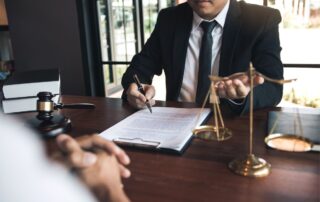 Lawyer and client discussing legal fees.
