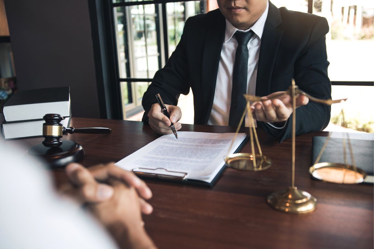 Lawyer and client discussing legal fees.