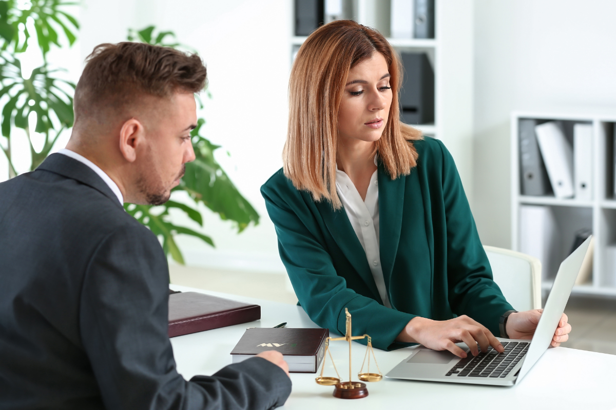 Lawyer and client meeting in an office to discuss legal consultation costs.