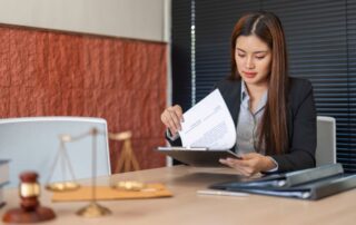 Lawyer carefully reviewing legal documents.