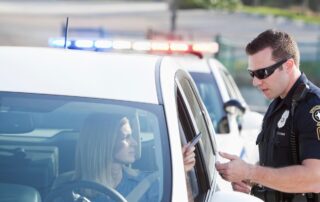 Police officer speaking to a woman.