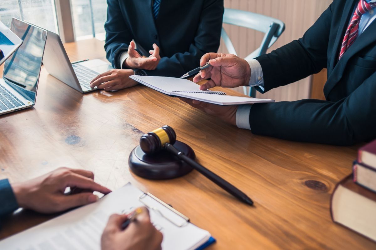 Client reviewing release conditions with a lawyer.