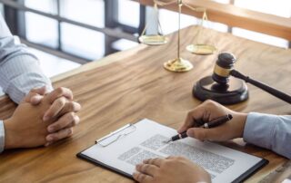 Consultation between a male lawyer and client, giving advice and prosecutions.