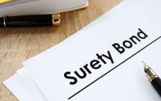 Surety bond form and pen on the table.