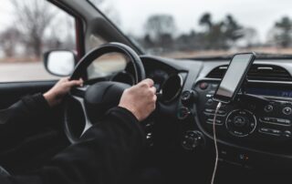 A man is driving a car.