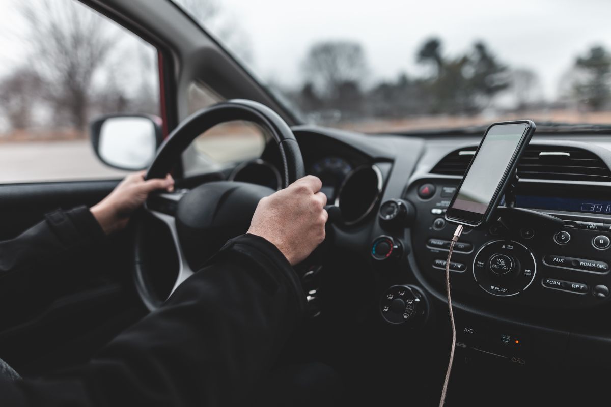 A man is driving a car.