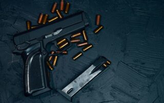 Handgun with loose bullets.
