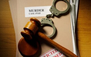 Gavel, handcuffs, and a case file.