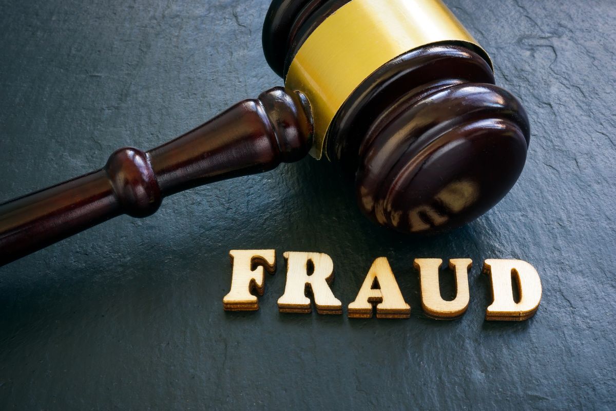 Wooden gavel beside the word "FRAUD"