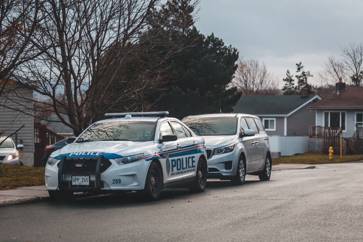 Police car parked near a private property sign.
