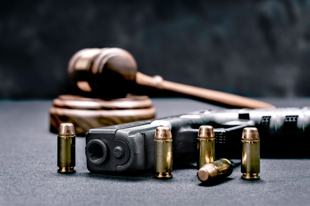 A gavel, a handgun, and bullets.
