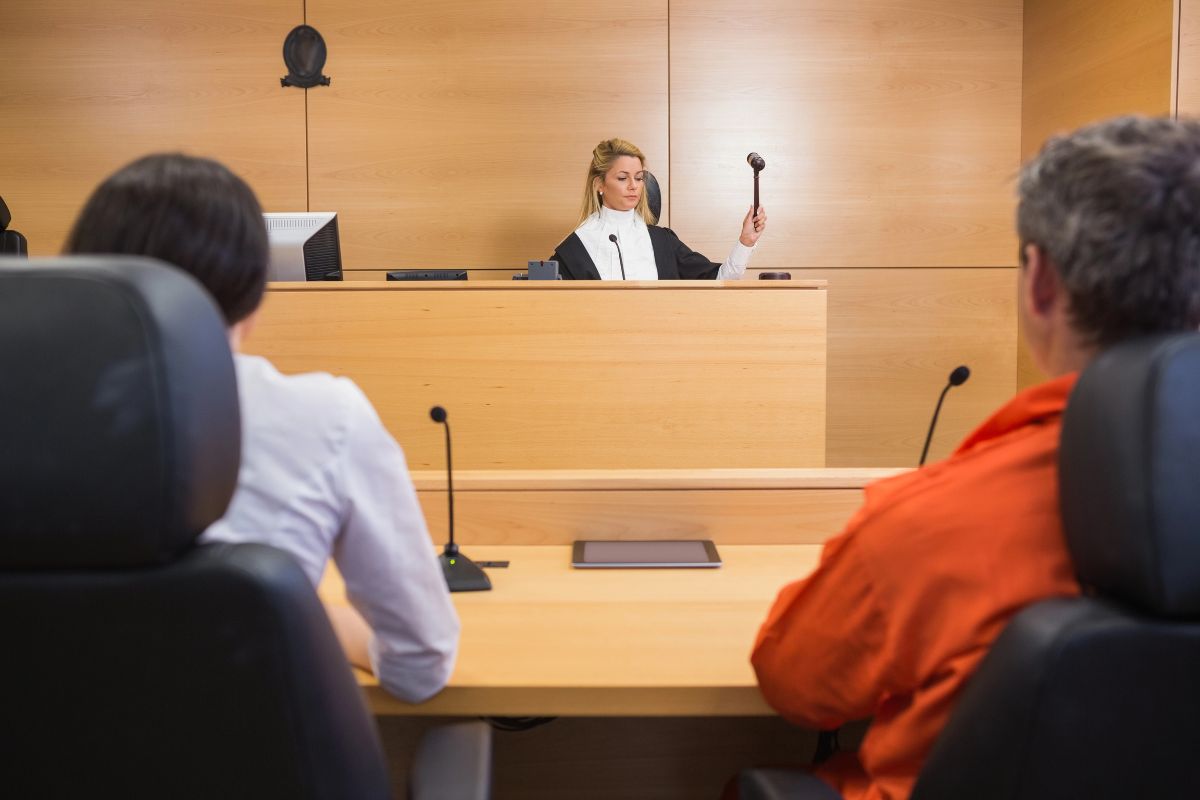Lawyer and client listening to judge.