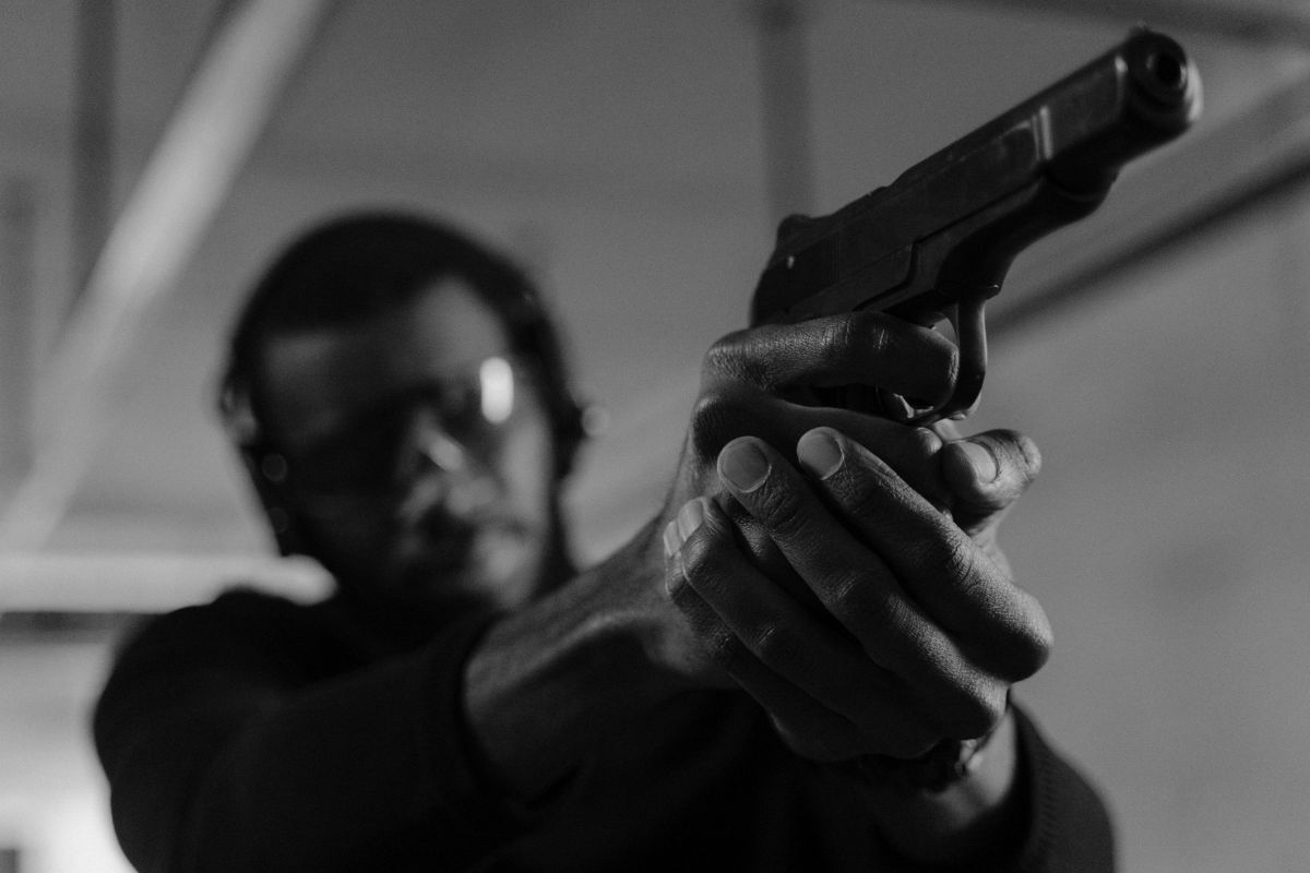 Man aiming a handgun.