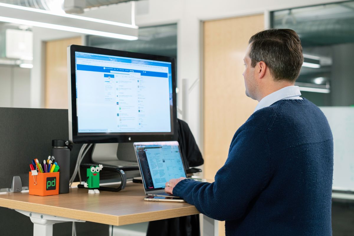 A man is using a computer.