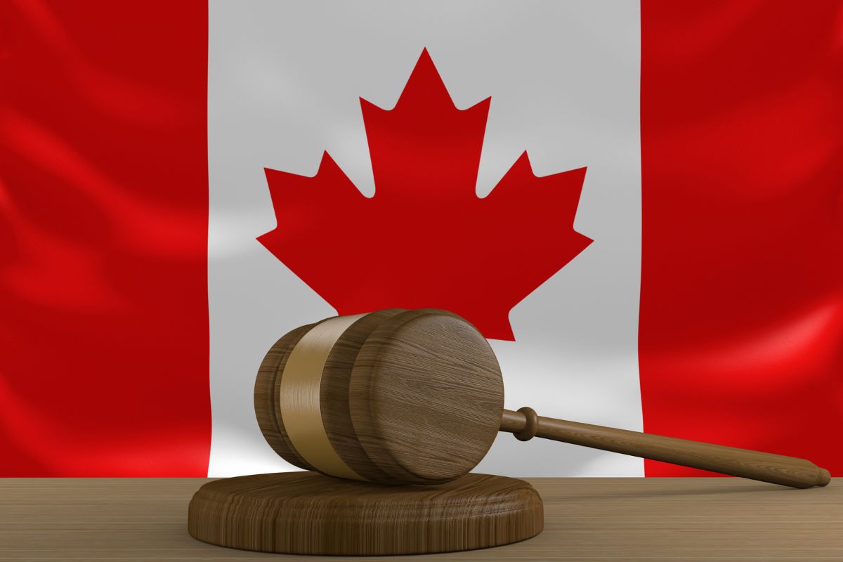 Wooden gavel with the Canadian flag.