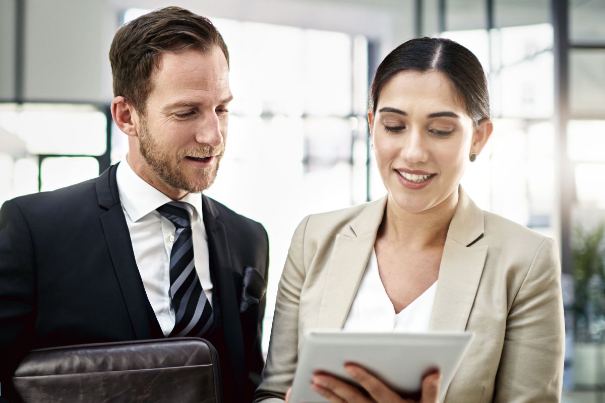 Lawyer and paralegal working together over legal documents.