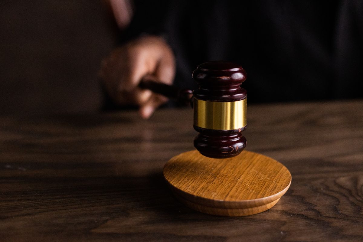 Gavel on judge’s bench in courtroom.