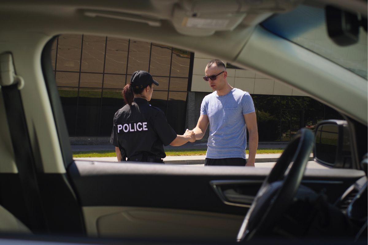 Police officer speaking with a man.