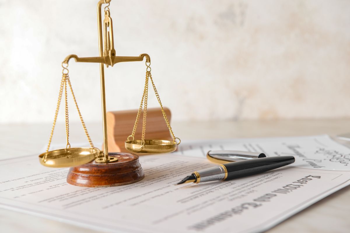 Scales of justice with documents and papers.