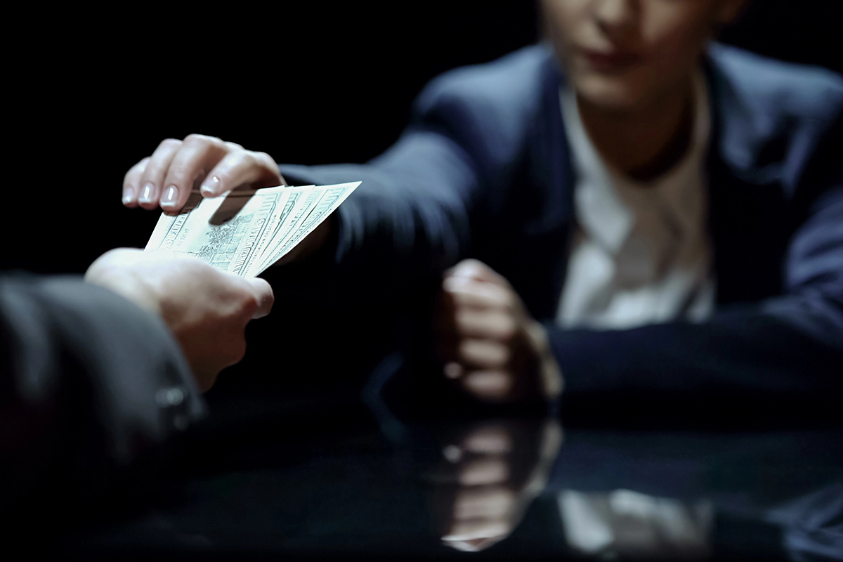 A woman accepting a bribe.