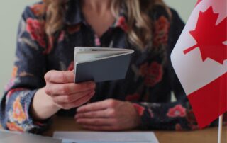 Woman holding a Canadian passport.