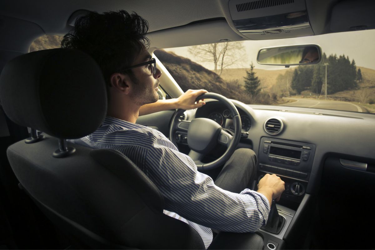 Man driving a car.