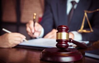 Two people reviewing legal documents.
