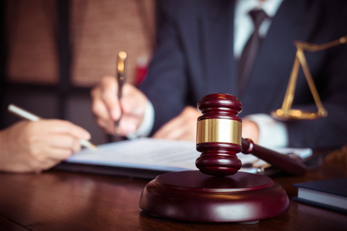 Two people reviewing legal documents.