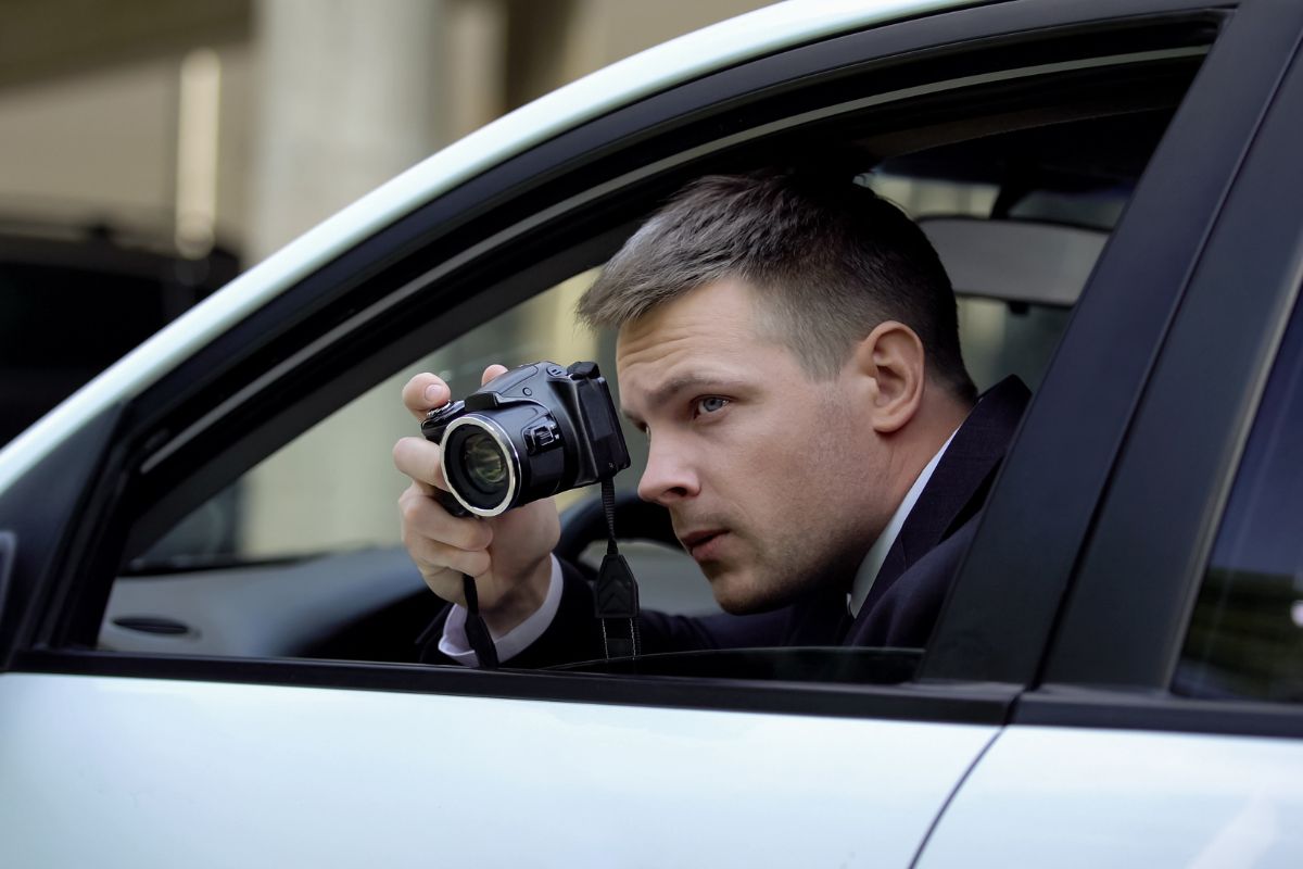 A man is secretly taking photos.