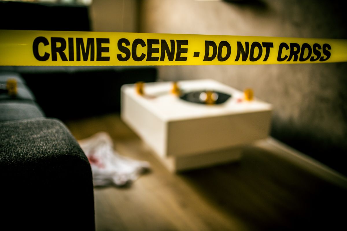 Yellow crime scene tape blocking off a room. Yellow crime scene tape blocking off a room.