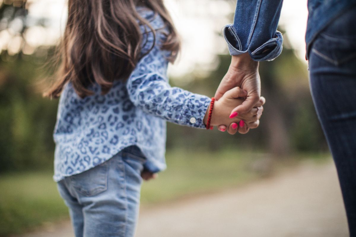 A child holding a woman hands. A child holding a woman hands.