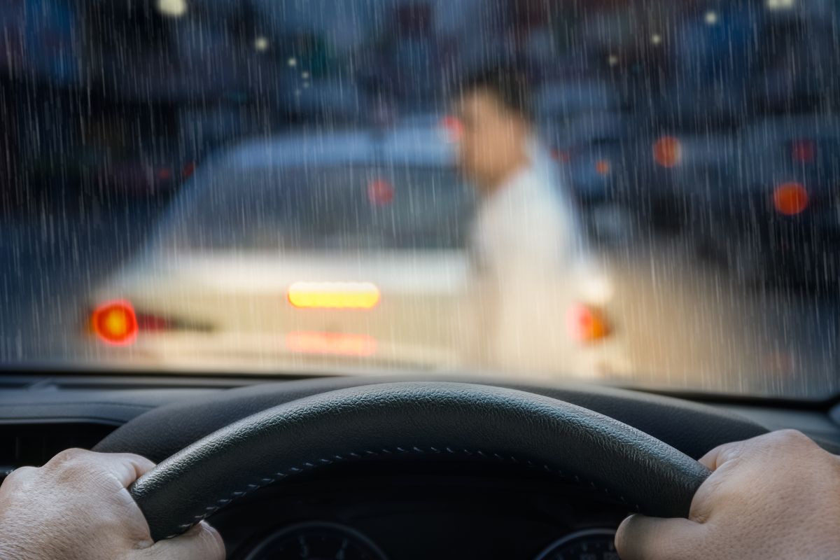 Driver’s view through a rainy windshield. Driver’s view through a rainy windshield.