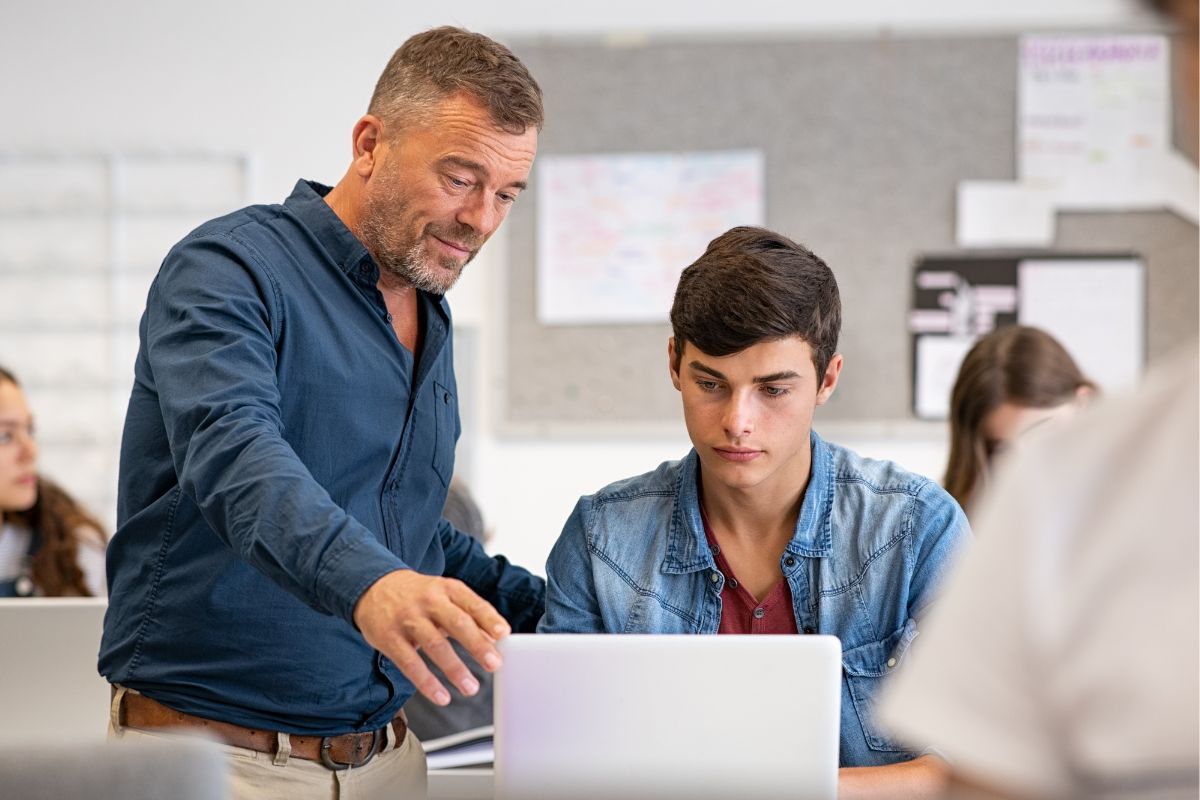 A youth talking with a counselor.