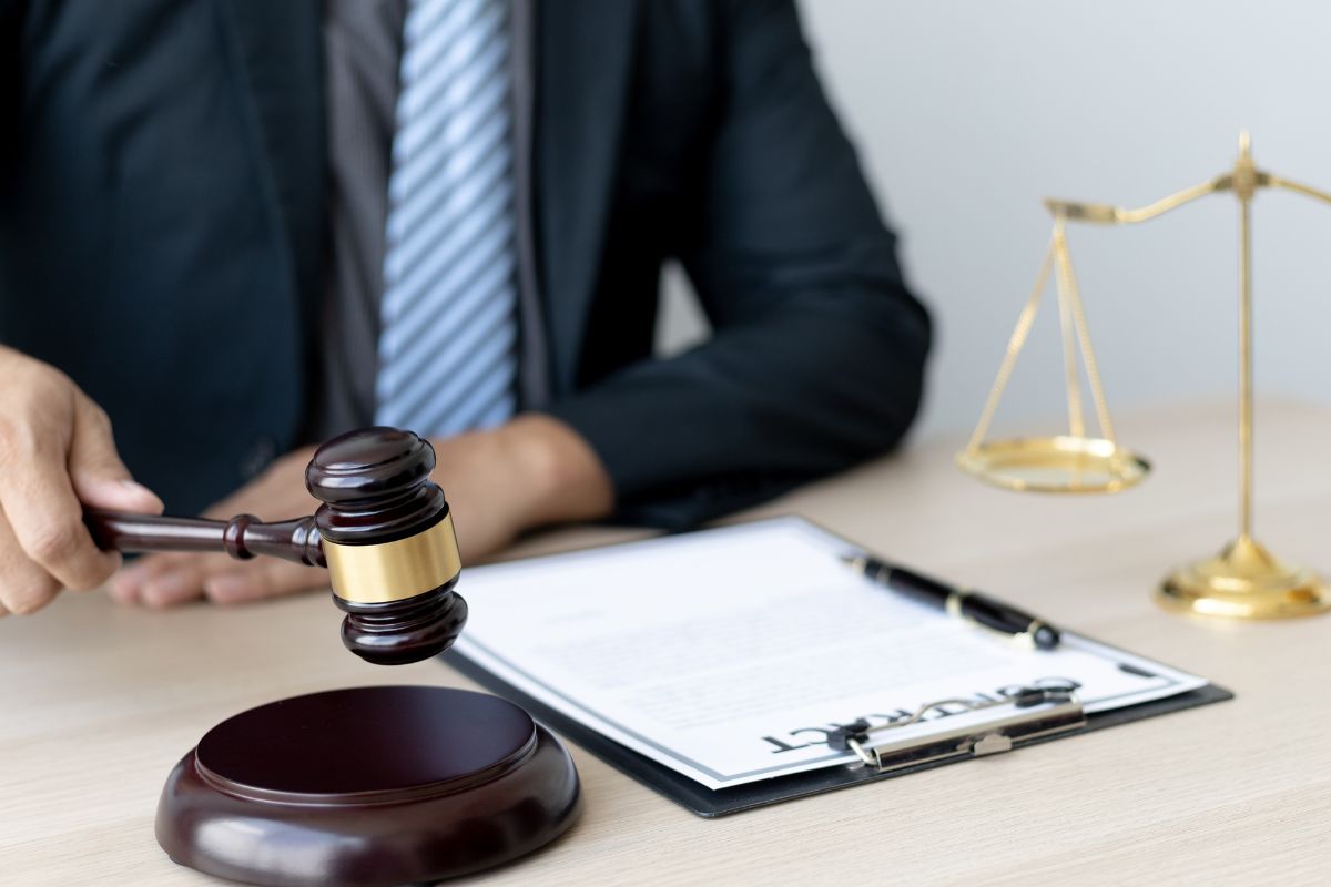 Conditional discharge legal decision with gavel and court document. Conditional discharge legal decision with gavel and court document.