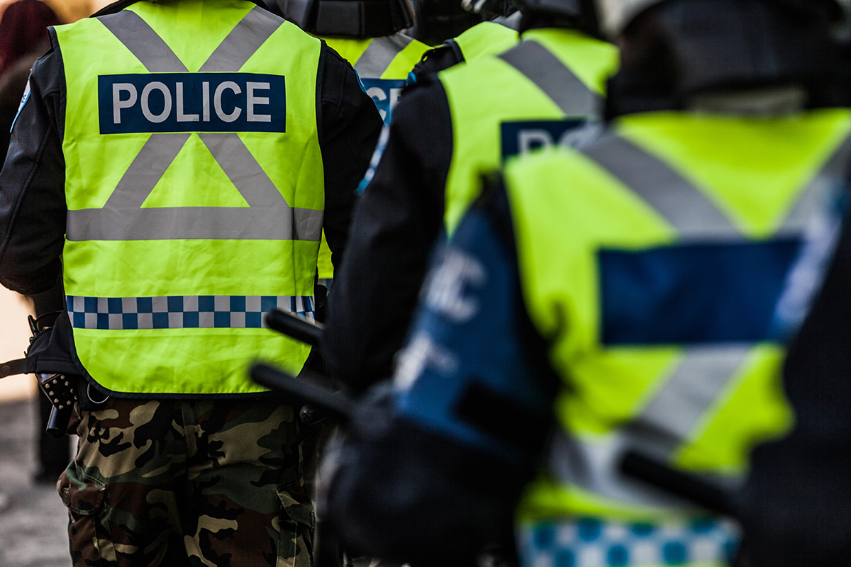 Police officers in yellow vests