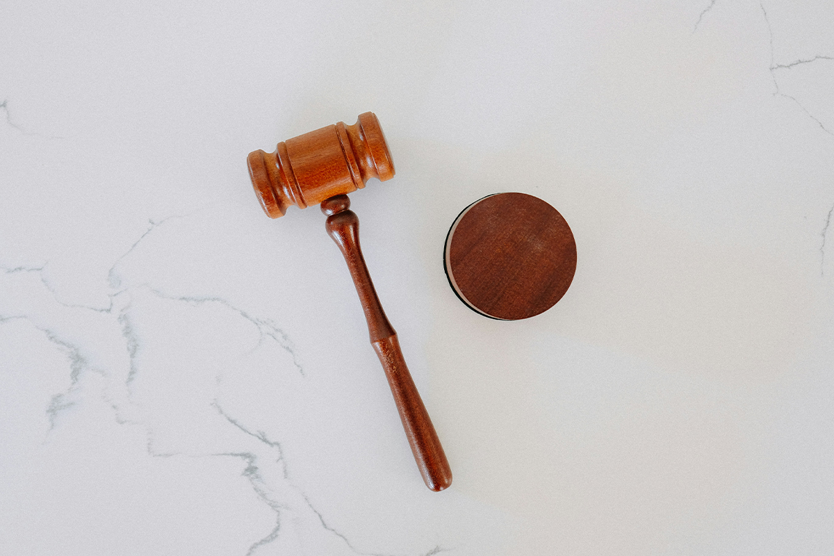 A gavel on a white table