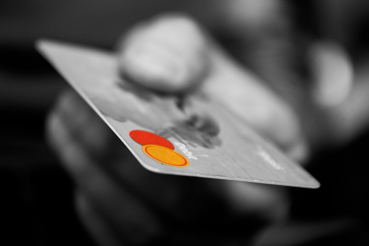 A person holds a fraudulent credit card