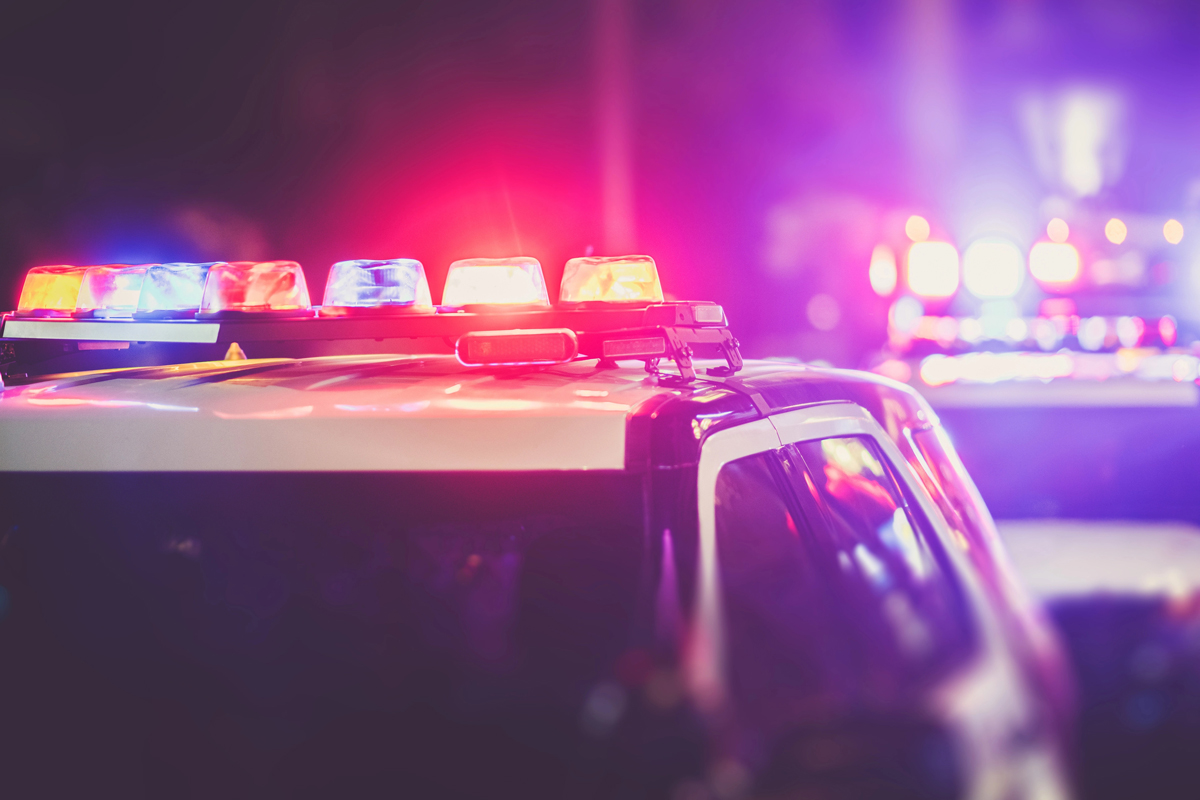 A police car with its lights flashing.