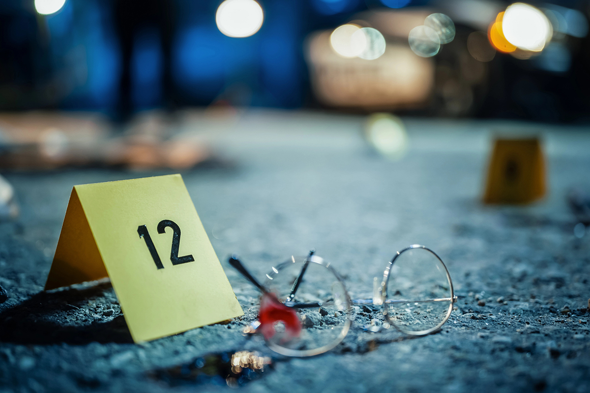A pair of glasses next to an evidence marker