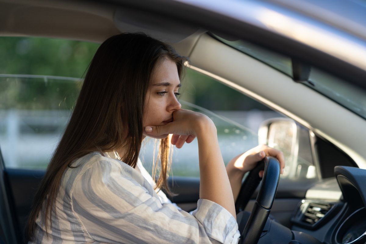 A woman sitting in a car.