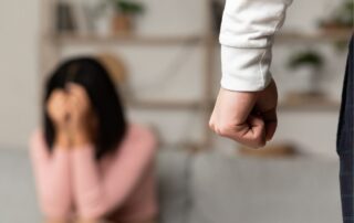 An angry husband is threatening his wife.