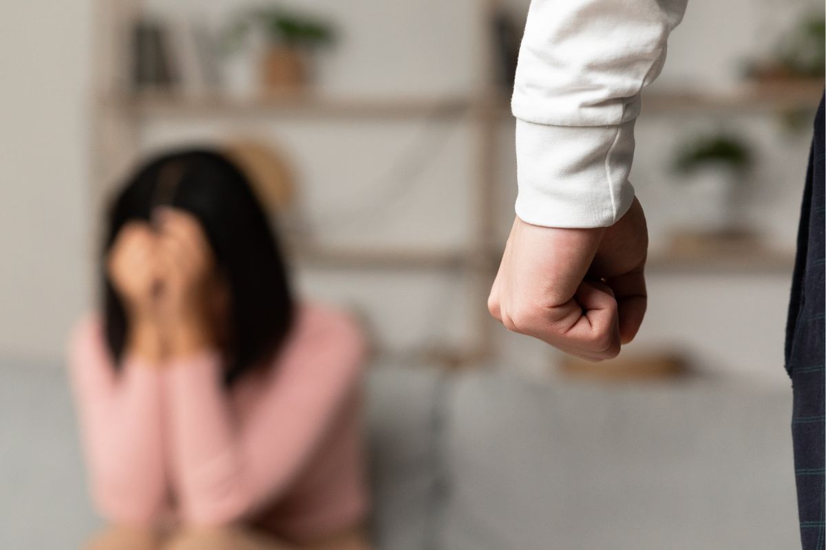 An angry husband is threatening his wife. An angry husband is threatening his wife.