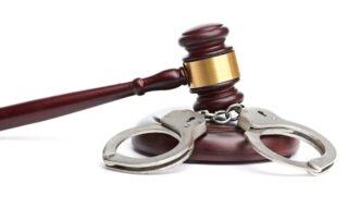 Gavel and handcuffs.
