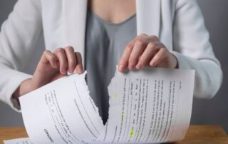Ripping paper document and breaching rules.