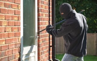 Burglar breaking into the house.